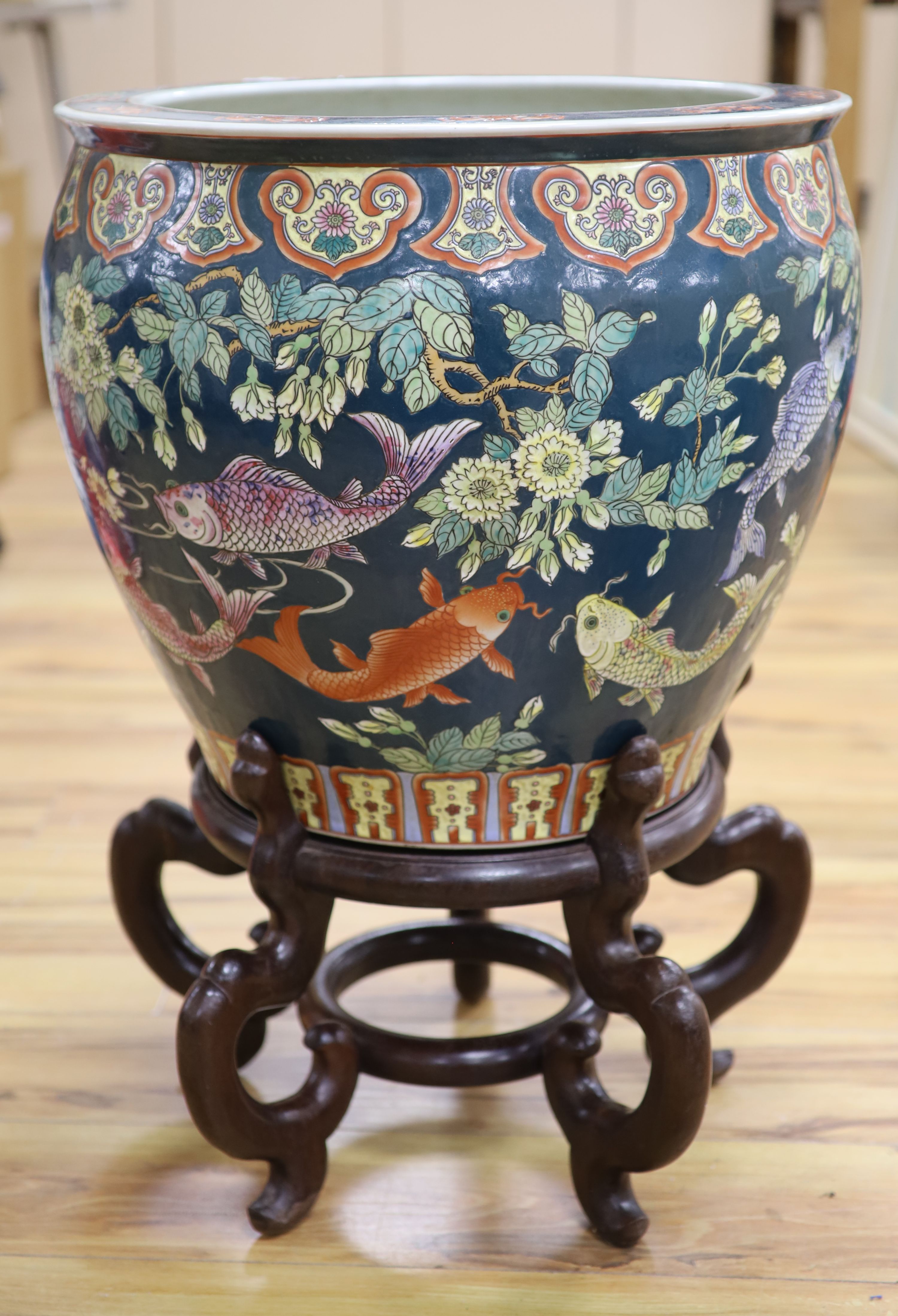 A Chinese porcelain fish bowl on stand, diameter 47cm